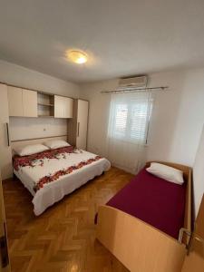Postel nebo postele na pokoji v ubytování Apartment Martina Tučepi