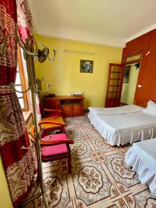 Postel nebo postele na pokoji v ubytování Viet Duc Guest House
