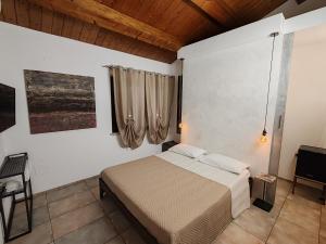 Postel nebo postele na pokoji v ubytování B&B Flavio e Catia