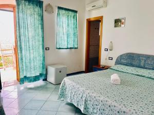 Voodi või voodid majutusasutuse B&B Giardini di Iside e Osiride toas