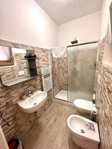 a bathroom with a toilet and a sink and a shower at Affittacamere Villa Ginevra in Gallipoli
