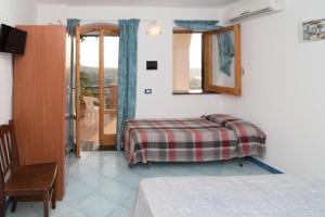 Voodi või voodid majutusasutuse B&B Giardini di Iside e Osiride toas