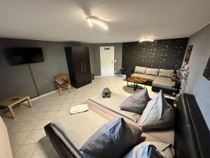 a living room with two beds and a couch at Villa Hardegsen in Hardegsen