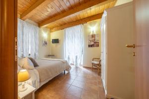 Postel nebo postele na pokoji v ubytování La Suite del Borgo