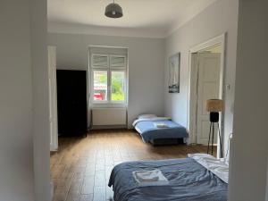 Voodi või voodid majutusasutuse DANA GUEST HOUSE toas
