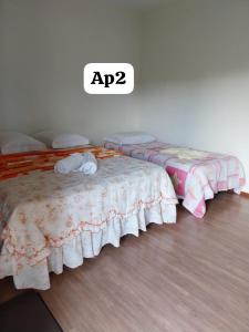 Una cama o camas en una habitación de Pousada do Dedé