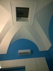 a bathroom with a blue and white ceiling at I Cieli Di Ostuni in Ostuni