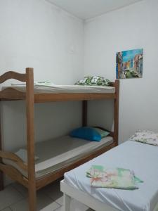 a couple of bunk beds in a room at Pousada Solar do Lazer in Recife