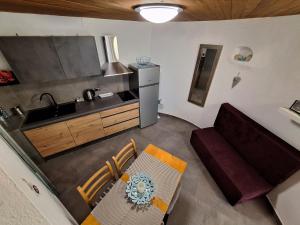 a kitchen with a couch and a sink and a counter at Old Mill in Rogoznica +27 photos