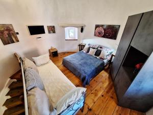 a living room with two beds and a couch at Old Mill in Rogoznica