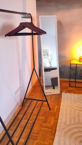 a floor lamp in a living room with a room at Bright, Modern and Spacious - Apartment "Lola" Family & Workplace in Gießen