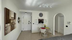 a living room with a table and a dining room at CASA EVA Naturista, Vera Playa in Playas de Vera