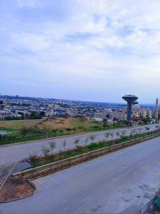 an empty road with a view of a city at Elite Living Hotels in Rawalpindi