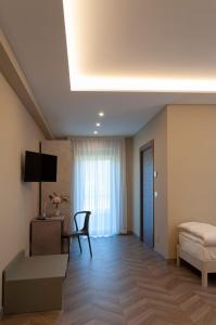 a living room with a bed and a table at Tenute Masullo in Pedale +41 photos