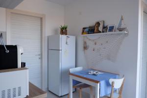 Kuchyňa alebo kuchynka v ubytovaní Terrazza sul Plemmirio