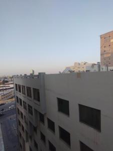 a view of a building in a city at Fully furnished room in Sharjah