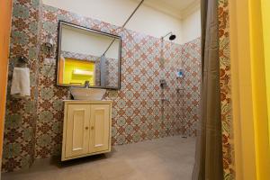 a bathroom with a sink and a mirror at Sheel Mahal- Near Hawa Mahal in Jaipur