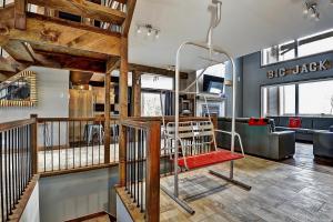 a living room with a red bench in a building at The Big Jack Chalet 33 Chemin Blanc by Les Chalets Alpins in Stoneham