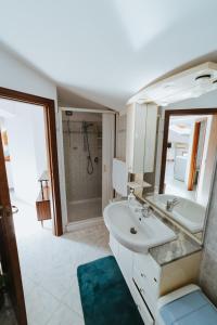 a bathroom with a sink and a mirror at Sguardo sul mare in Petacciato