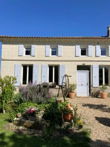 a house with a garden in front of it at Les Ganivelles in Saint-Dizant-du-Gua