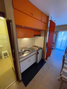 a small kitchen with a sink and a counter at Le D'Artagnan - App 9 - Balcon in Cazaubon