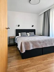 Posteľ alebo postele v izbe v ubytovaní Old Town Plaza Apartment