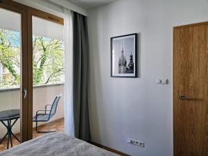 Posteľ alebo postele v izbe v ubytovaní Old Town Plaza Apartment