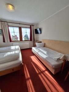 Postel nebo postele na pokoji v ubytování Hotel Zum Breiterle