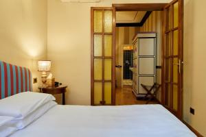 Postel nebo postele na pokoji v ubytování Hotel Hermitage