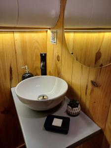 a bathroom with a white sink on a counter at SLEEPBOAT LuxLife Yatch in Porto