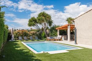 a swimming pool in a yard with a patio at Nice Renting - BELLET - Live A Dream Villa Pool 3 Bedroom Garden Parking in Nice