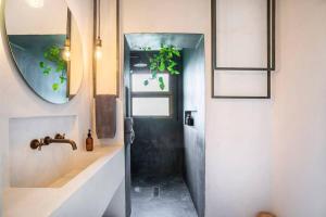 a bathroom with a sink and a mirror at ThePineRooms in Arenys de Munt +36 photos