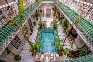 an overhead view of a swimming pool in a house at Riad Samir Privilege Boutique Hotel & Spa in Marrakech