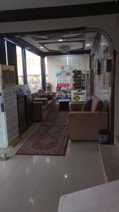 a living room with couches and a rug at العييري للشقق المفروشة االنعيريه 1 in Al Nairyah