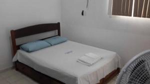 Tempat tidur dalam kamar di Residencial Dom Luiz