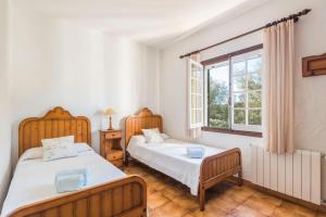 Postel nebo postele na pokoji v ubytování Finca Ses Curtanetas