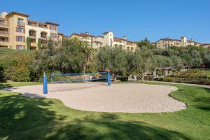 a volleyball court in a park with buildings in the background at Marriott's Newport Coast Villas in Newport Beach