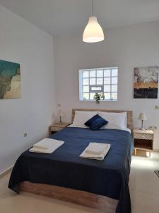 Ένα ή περισσότερα κρεβάτια σε δωμάτιο στο Olea Homes