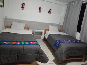 Letto o letti in una camera di HOSTAL La RASA
