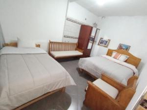 Letto o letti in una camera di HOSTAL La RASA