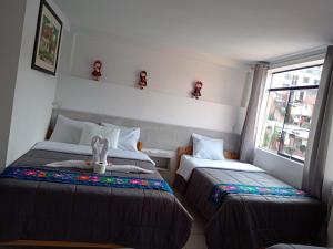 Letto o letti in una camera di HOSTAL La RASA