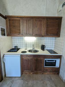 Η κουζίνα ή μικρή κουζίνα στο Meltemi Apartments