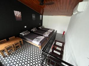 a small room with a bed and a table at Nguyen Shack - Phong Nha Resort in Phong Nha