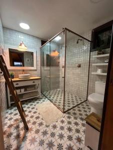 a bathroom with a shower and a toilet at Vallée Cabanas in Urubici +51 photos