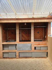 a kitchen with three sinks in a building at BLISS HOUSE & spa 92 in Barranquilla