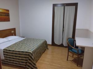 Postel nebo postele na pokoji v ubytování Hotel Nicolaj