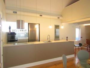 a kitchen with a sink and a counter top at Duplex de lujo junto al Bernabéu Real Madrid in Madrid