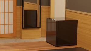 a black refrigerator in a room with a tv at My Home Inn Sennan, Onosato in Ozaki