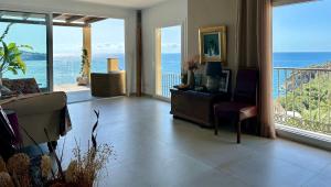 a living room with a view of the ocean at Beautiful House with splendid sea views, Calaiza Beach in La Herradura
