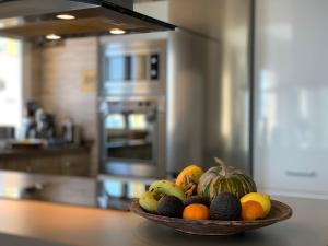 a bowl of fruit on a counter in a kitchen at Beautiful House with splendid sea views, Calaiza Beach in La Herradura